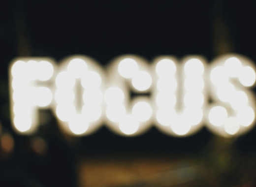 The Word Focus Spelled In Blurry Lights